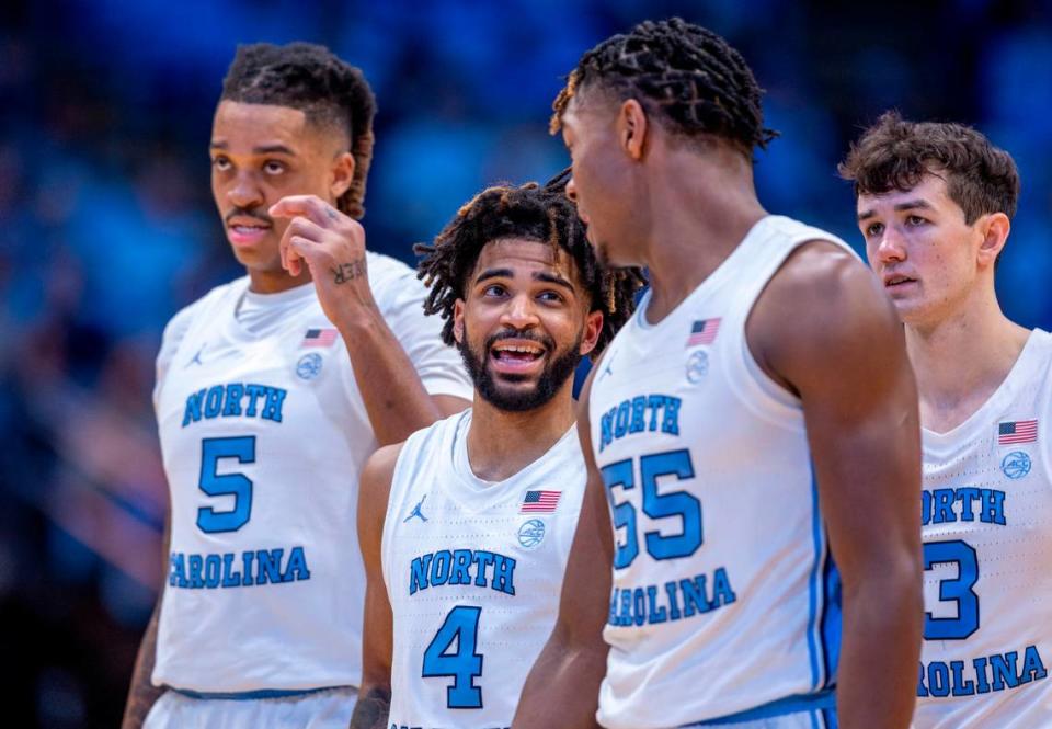 North Carolina’s R.J. Davis (4) chats with teammate Harrison Ingram (55) during a time out in the first half against Charleston Southern on Friday, December 29, 2023 at the Smith Center in Chapel Hill, N.C. Robert Willett/rwillett@newsobserver.com