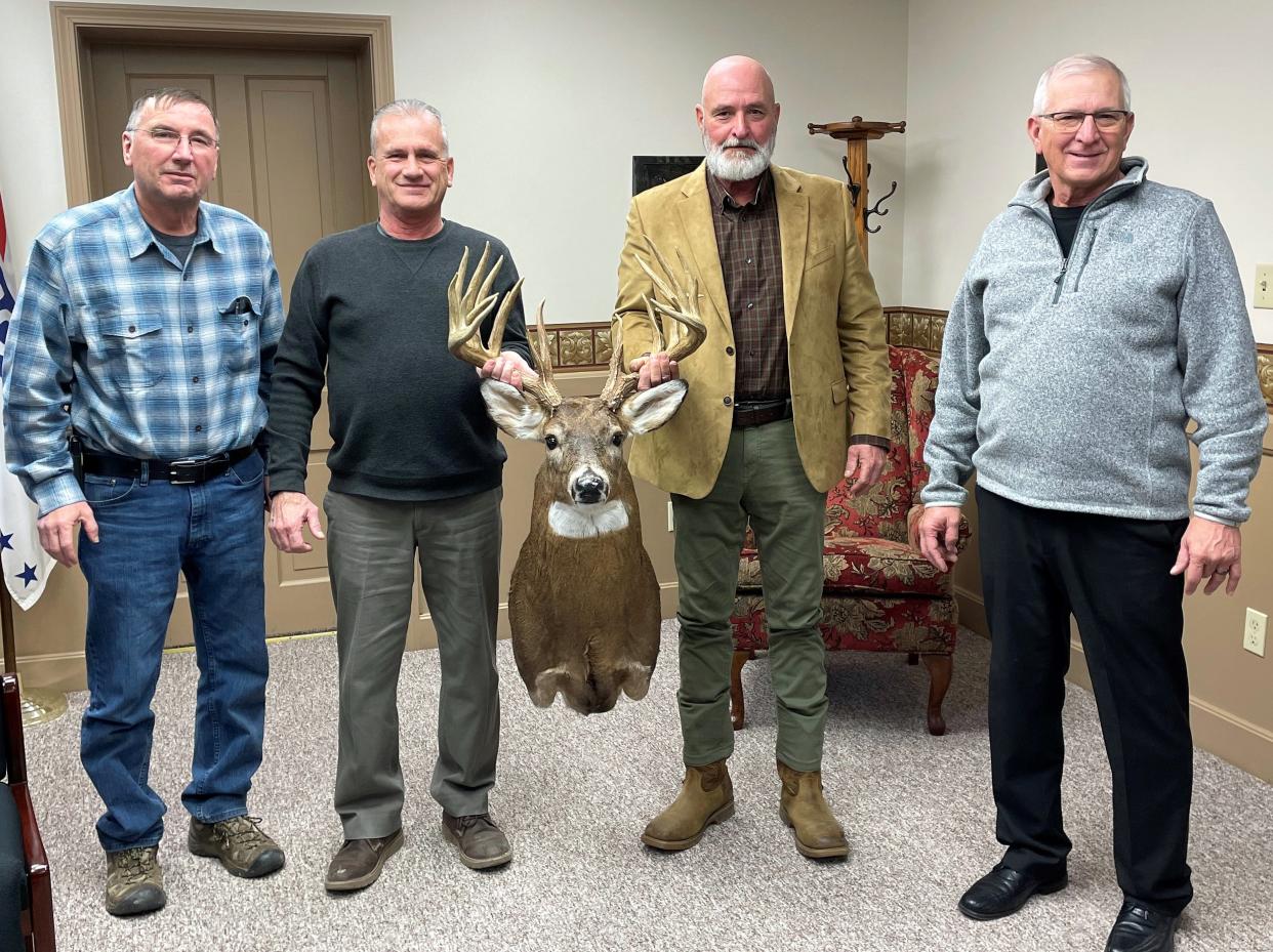 Chuck Wiseman of the Coshocton County Sportsman Association with Commissioners Gary Fischer, Rick Conkle and Dane Shryock with Hayrake, a legendary 26-point buck with a 228-inch circumference. The deer poached in 2018 is now owned by the commissioners and will be on display at the CCSA office.