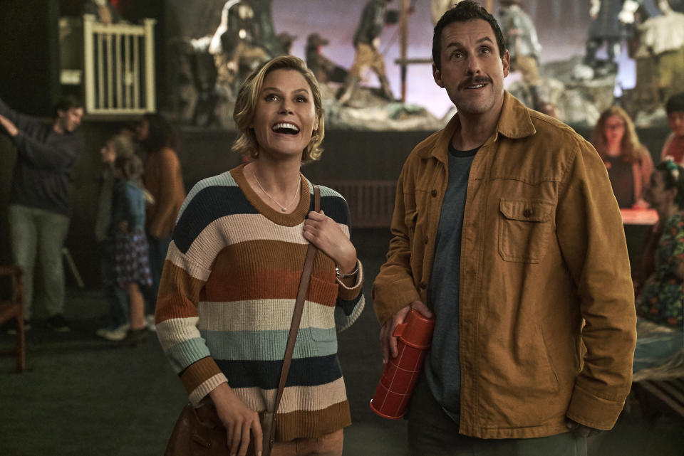 This image released by Netflix shows Julie Bowen, left, and Adam Sandler in a scene from "Hubie Halloween." (Scott Yamano/Netflix via AP)