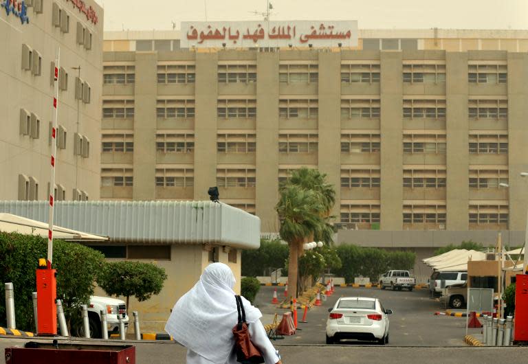 A Saudi nurse walks towards the King Fahad hospital in Hofuf, some 370 km East of the capital Riyadh, on June 16, 2013