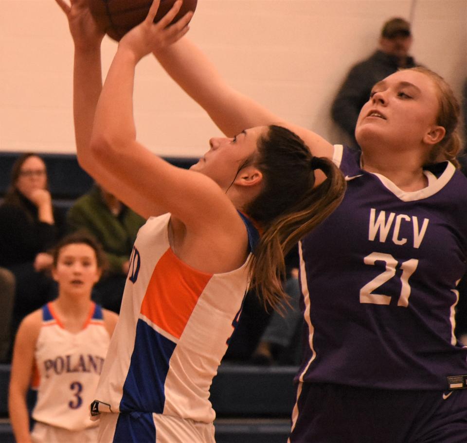 Maddison Haver shoots for Poland with West Canada Valley Nighthawk Ava Fellows (right) defending in the fourth quarter Thursday.