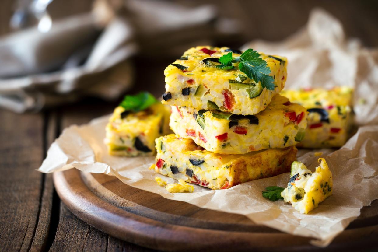 Homemade vegetarian rice frittata with zucchini, bell pepper and olives