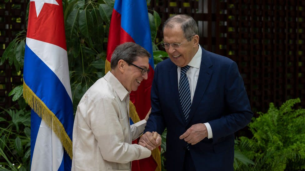 Russian Foreign Minister Sergey Lavrov (R) and Cuba's Minister of Foreign Affairs, Bruno Rodriguez, shake hands during a meeting in Havana on April 20, 2023