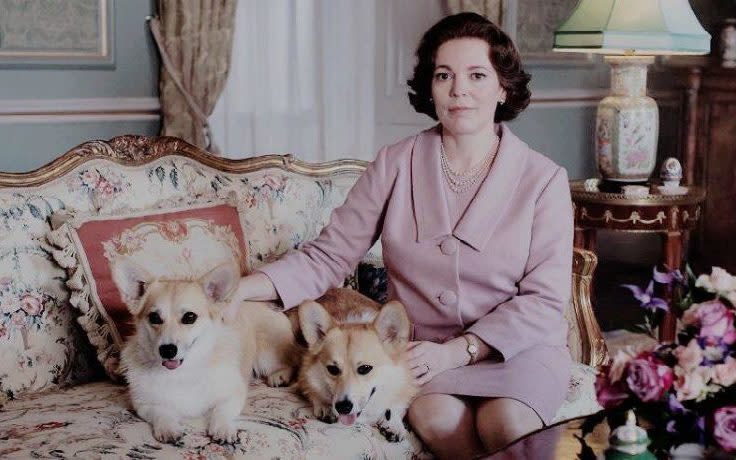 Olivia Colman, who took over the role of Queen Elizabeth from Claire Foy for Season 3 of The Crown, with some of her co-stars, including the Pembroke Welsh Corgis  - Netflix
