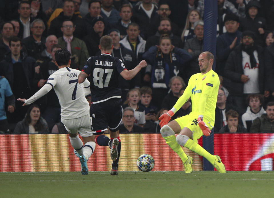 Tottenham's Son Heung-min, left, scores his side's third goal during the Champions League, group B, soccer match between Tottenham and Red Star Belgrade, at the Tottenham Hotspur stadium in London, Tuesday, Oct. 22, 2019. (AP Photo/Ian Walton)