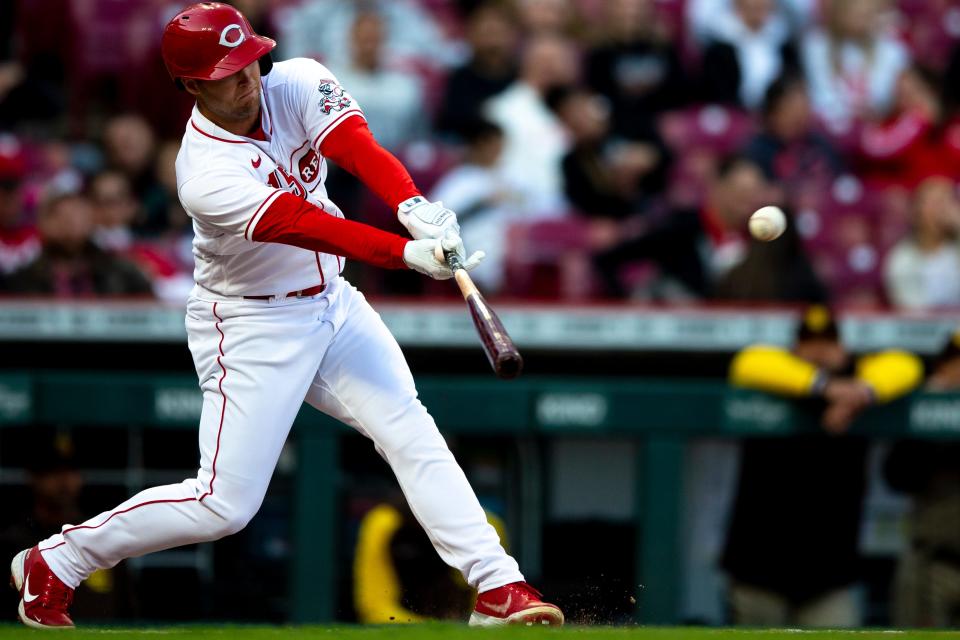 Cincinnati Reds center fielder Nick Senzel (15) hits a base hit in the second inning of the MLB baseball game between Cincinnati Reds and San Diego Padres at Great American Ball Park in Cincinnati on Tuesday, April 26, 2022.