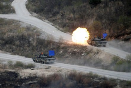 FILE PHOTO: South Korean Army K1A1 tanks fire live rounds during a U.S.-South Korea joint live-fire military exercise at a training field, near the demilitarized zone, separating the two Koreas in Pocheon, South Korea April 21, 2017. REUTERS/Kim Hong-Ji