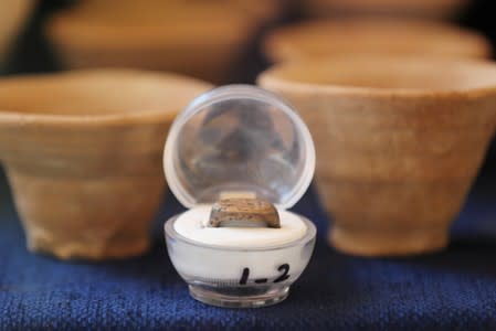 A silver ring is displayed during the presentation of a new discovery in the Monkey Valley near the Valley of the Kings in Luxor