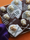 <p>Put your chocolate cravings to rest with these spooky treats made with chocolate butter cookie dough and white chocolate skulls.</p><p><a href="https://www.womansday.com/food-recipes/food-drinks/recipes/a11067/chocolate-tombstone-cookies-recipe-122454/" rel="nofollow noopener" target="_blank" data-ylk="slk:Get the Chocolate Tombstone Cookies recipe.;elm:context_link;itc:0;sec:content-canvas" class="link "><strong><em>Get the Chocolate Tombstone Cookies recipe.</em></strong></a></p>