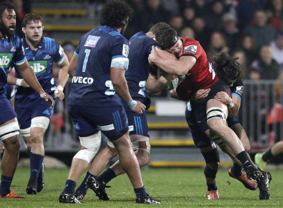 Crusaders Scott Barrett runs at the Blues defence during their Super Rugby match in Christchurch, New Zealand, Saturday, May 25, 2019. (AP Photo/Mark Baker)