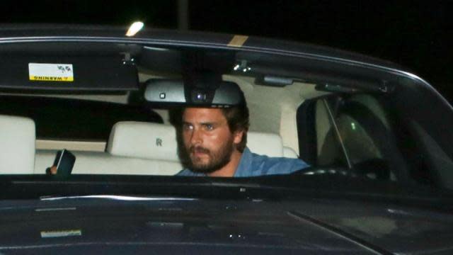 It appears it's back to business as usual for Scott Disick. The 32-year-old reality star was spotted for the first time on Tuesday since news broke that he and Kourtney Kardashian have split after nine years together, driving his Rolls-Royce around in Beverly Hills, California. Scott is currently living in Beverly Hills since moving out of Kourtney's home in Calabasas, California, earlier this month. Scott arrived at home to pick something up, then hurriedly drove off to evade paparazzi, an eyewitness tells ET. <strong>WATCH: Scott Disick Returns to L.A. as Scantily Clad Women Seen Outside His Bachelor Pad</strong> Meanwhile, 36-year-old Kourtney was also spotted out and about on Tuesday in Los Angeles, filming an episode of <em>Keeping Up With the Kardashians</em> alongside her mother, Kris Jenner, and sister Khloe Kardashian -- who's fresh off her emotional divorce. Rocking a sleeveless suede dress and lace-up boots, it was pretty obvious that going extra hard at the gym lately has paid off for the slim-looking mother of three. <strong>NEWS: Khloe Kardashian's Emotional Tweet After Finally Signing Divorce Papers</strong> Splash News But while Kourtney's main focus appears to be on her fitness goals and spending time with their three kids -- Mason, 5, Penelope, 3, and Reign, seven months -- Scott is apparently in the mood for company. Last Thursday, multiple scantily clad women were seen at his new bachelor pad, an eyewitness telling ET that at least six girls were spotted at the residence. "A couple of the girls were calling Scott’s name from the gate to be let in," the source said. Kourtney and Scott split over the Fourth of July weekend, after he was snapped getting touchy-feely with his ex-girlfriend, Chloe Bartoli, in Monte Carlo. Scott has been spending an increasing amount of time with friends who "are not a good influence" on him and "not looking out for his best interests," a source told ET about their breakup. <strong>WATCH: Kris Jenner Says Kourtney Kardashian Is 'Hanging in There' After Scott Disick Split</strong> Watch the video below for more on Scott's new bachelor pad.