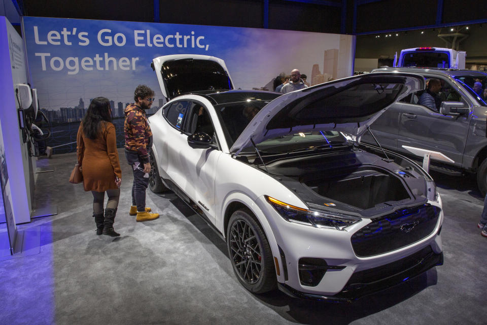 A Ford Mustang Mach-E electric vehicle with Ford BlueCruise Hands-Free Highway Driving stands at the New York International Auto Show in New York on Saturday, March 30, 2024. (AP Photo/Ted Shaffrey)
