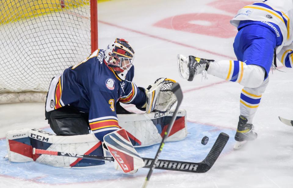 Peoria Rivermen goaltender Eric Levine knocks the puck away from a Roanoke player in the third period of Game 3 of the SPHL semifinals Sunday, April 23, 2023 at Carver Arena.