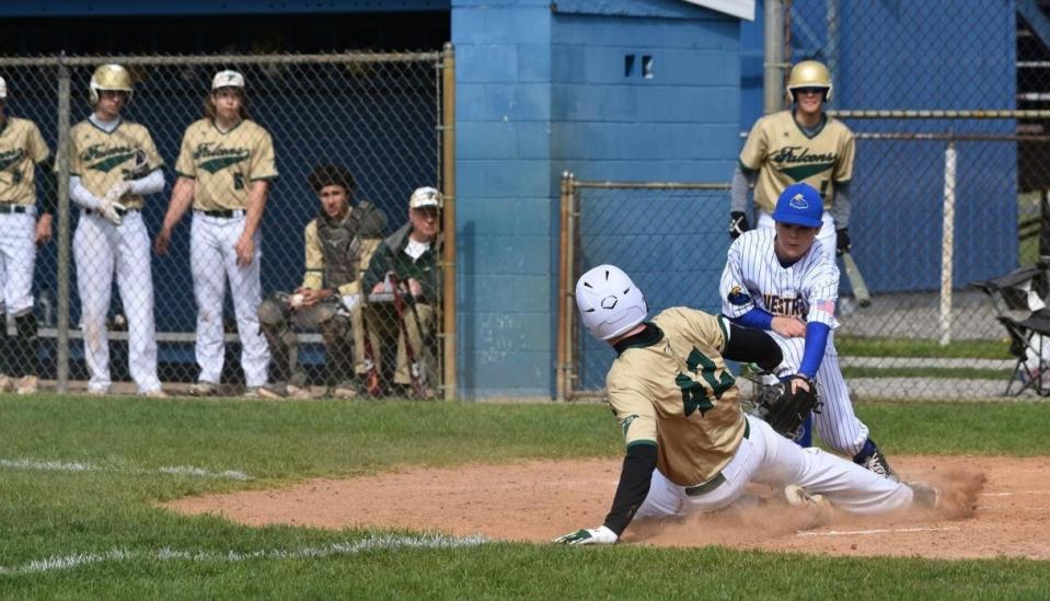 Jaxon Millican of Ida tags out St. Mary Catholic Central's Brennan Runyon at the plate Friday. SMCC built an early lead and held off the Blue Streaks for a 10-9 win.