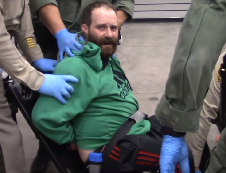 Nicholas Farah was restrained in a chair  in the Sally port of the Clark County Detention Center after he resisted arrest.