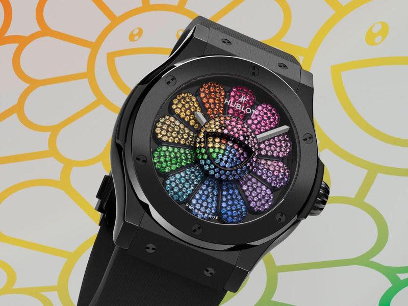 HUBLOT Classic Fusion Takashi Murakami Black Ceramic Rainbow 此為宇舶與村上隆合作的第三代錶款的第13只錶，至於前12只則要等到三月底日內瓦錶展才會公開。收藏家必須收集前12只錶的NFT，才能買這第13只。此錶以黑陶瓷錶殼配上彩虹寶石，可以說是所有錶款的「終極綜合版」。（圖片版權@TM/KK）