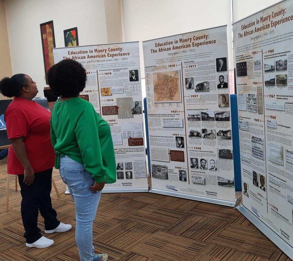 “Education in Maury County: The African American Experience” exhibit was displayed at the Maury County Library. (Left) Latoya Davis and Jackie Burkee tour the exhibit in Columbia, Tenn.