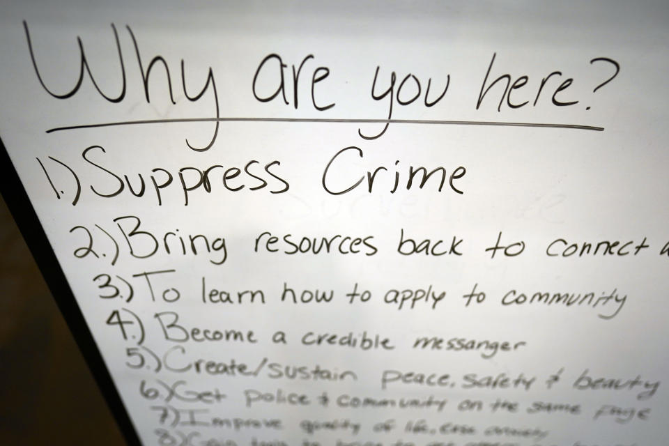 A board lists goals for participants attending a National Crime Prevention Council workshop Thursday, Sept. 29, 2022, in Houston. (AP Photo/David J. Phillip)