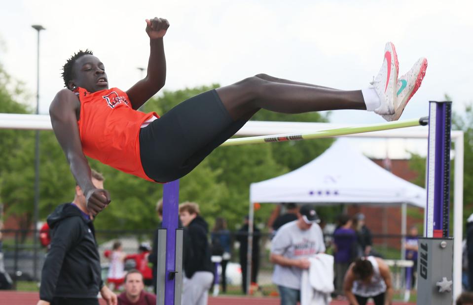 Ames’ Garang Deng crosses the bar during boys high jump in the class 4A State qualifying Co-Ed meet on Thursday, May 9, 2024, in Norwalk, Iowa.