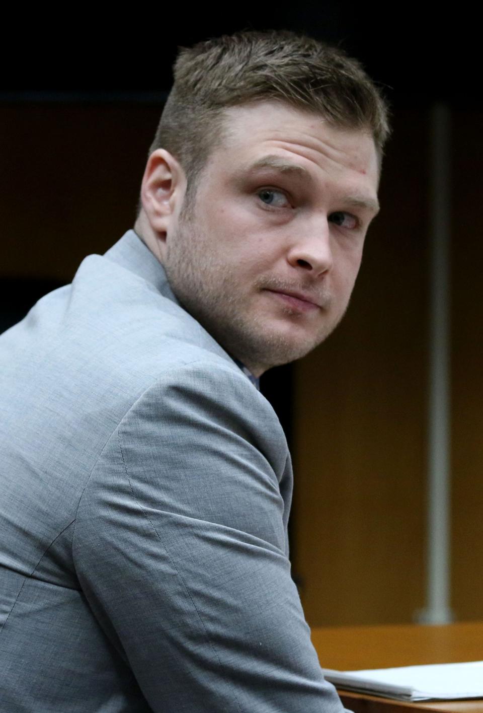 Christopher Gregor looks to the courtroom entrance as his mother Carolyn Gregor enters Thursday, May 9, 2024, for a hearing before Superior Court Judge Guy P. Ryan in Toms River Gregor is charged with the 2021 murder and child endangerment of his 6-year-old son Corey Micciolo.
