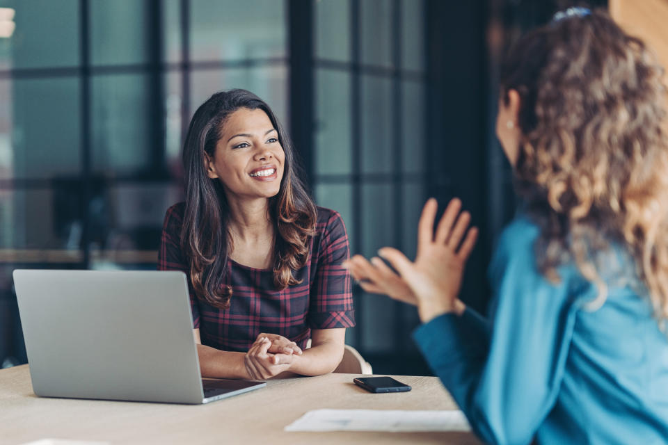 Coworkers meeting in an office