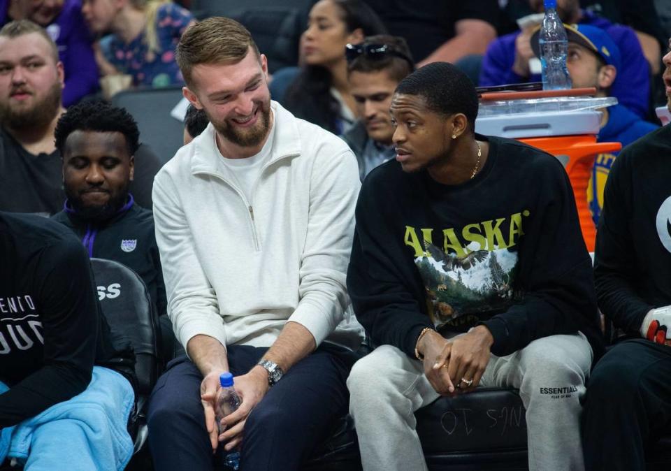 Sacramento Kings forward Domantas Sabonis and De’Aaron Fox sit on the bench Friday during the game against the Golden State Warriors at Golden 1 Center on Friday, April, 7, 2023, during the last regular season home game before playoffs begin.