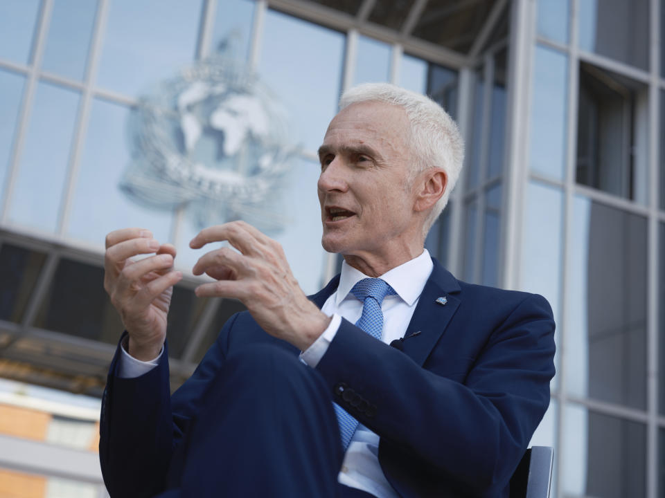 Interpol Secretary General Jurgen Stock talks to journalists during an interview outside the Interpol headquarters in Lyon, central France, Tuesday, Sept. 5, 2023. Jürgen Stock, who was appointed to the post in 2014 is beginning his last year in office. Interpol, which was founded in 1923, is celebrating its 100th anniversary this month. (AP Photo/Laurent Cipriani)