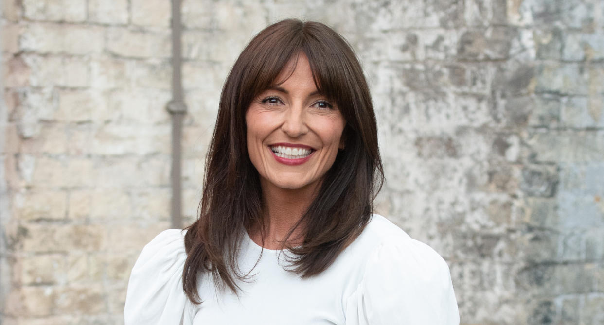 A headshot of Davina McCall wearing a white dress. (Getty Images)