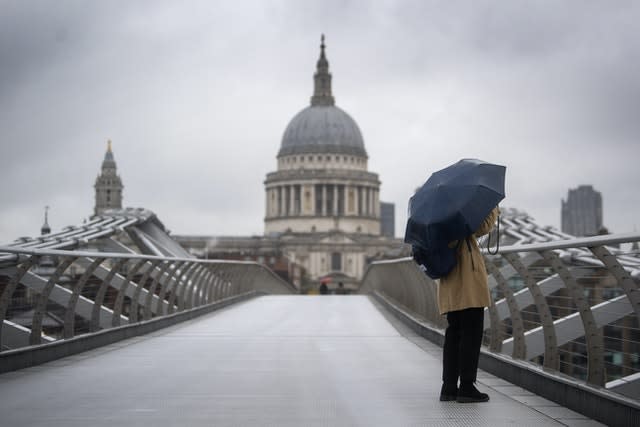 Stormy scenes on the Millennium Bridge in, London 