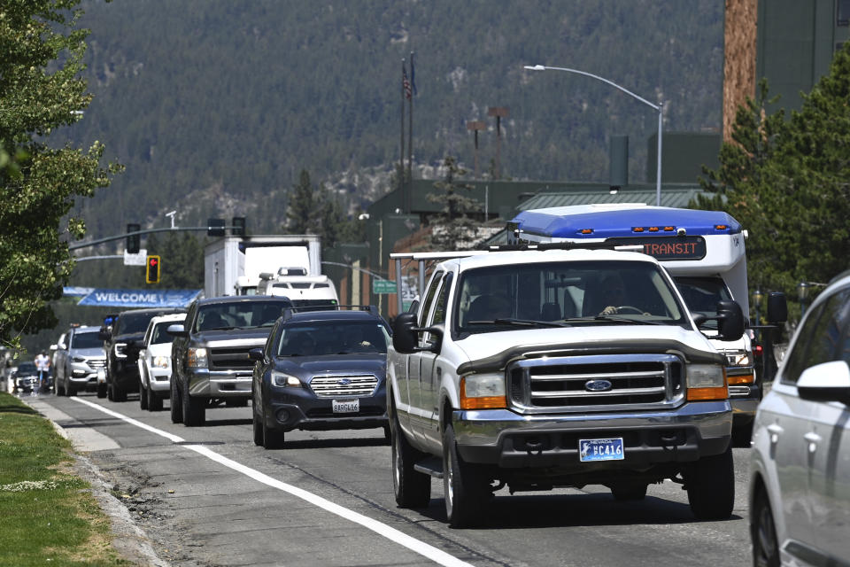 Traffic moves along Tahoe Boulevard in Stateline, Nev., on Monday, July 17, 2023. Tourism officials at Lake Tahoe were surprised, and a bit standoffish, when a respected international travel guide included the iconic alpine lake straddling the California line on a list of places to stay away from this year because of the harmful ecological effects of overtourism. (AP Photo/Andy Barron)