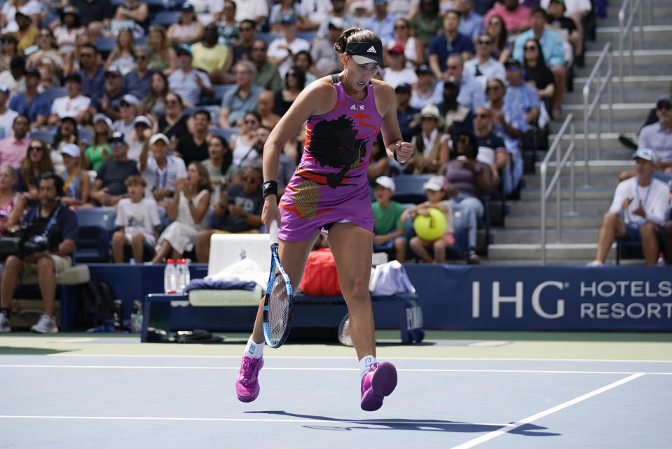 Garbine Muguruza, of Spain, reacts after scoring a point against Petra Kvitova, of the Czech Republic, during the third round of the U.S. Open tennis championships, Saturday, Sept. 3, 2022, in New York. (AP Photo/Eduardo Munoz Alvarez)