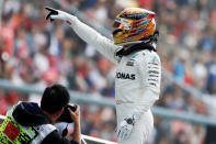 Formula One - F1 - Chinese Grand Prix - Shanghai, China - 08/04/17 - Mercedes driver Lewis Hamilton of Britain reacts after setting pole position in qualifying at the Shanghai International Circuit. REUTERS/Aly Song