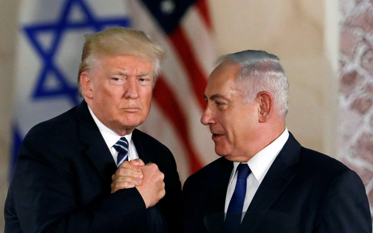 Donald Trump and Israeli Prime Minister Benjamin Netanyahu shake hands after Trump's address at the Israel Museum in Jerusalem  - Reuters