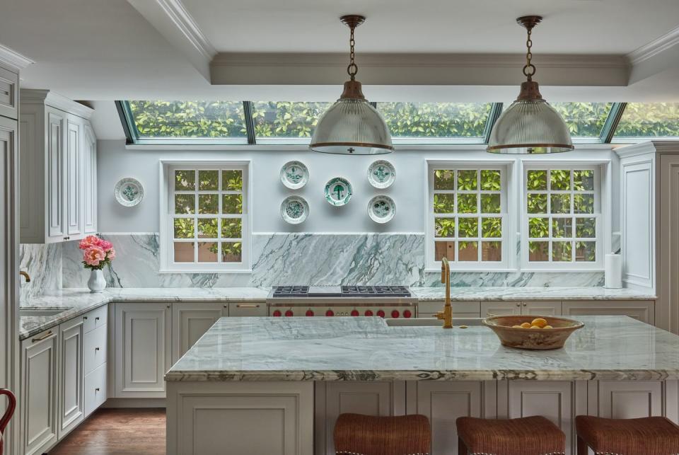 a kitchen with a marble island