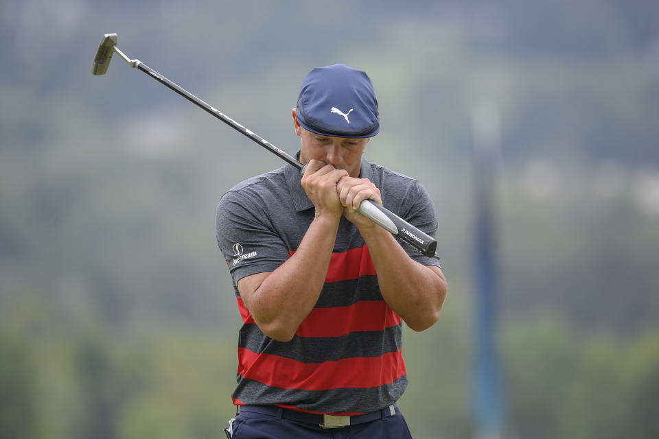 Bryson DeChambeau reacts after missing his putt on the ninth green during the final round of the BMW Championship golf tournament, Sunday, Aug. 29, 2021, at Caves Valley Golf Club in Owings Mills, Md. (AP Photo/Nick Wass)