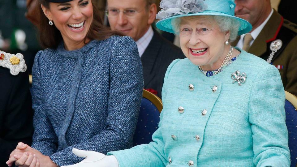 Catherine, Duchess of Cambridge and Queen Elizabeth II watch part of a children's sports event while visiting Vernon Park during a Diamond Jubilee visit to Nottingham on June 13, 2012 in Nottingham, England.