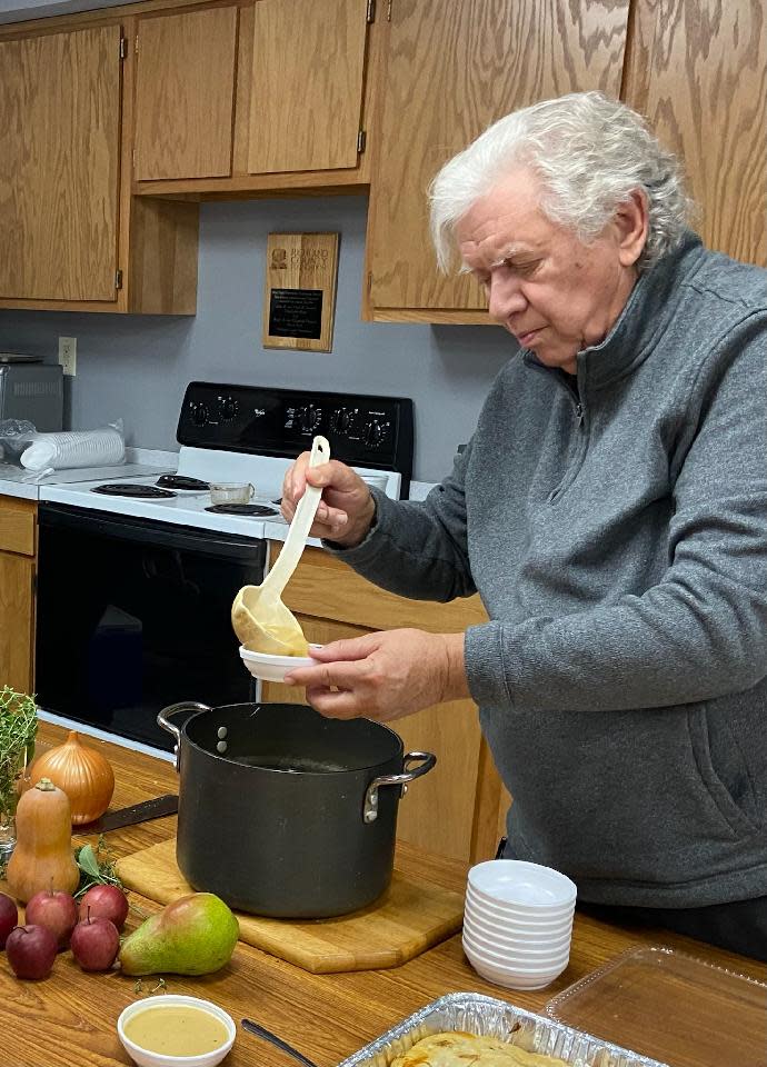 During the Oct. 9 meeting of master gardeners, Ed Pickens serves a sweet potato and apple bisque made right in front of the group.