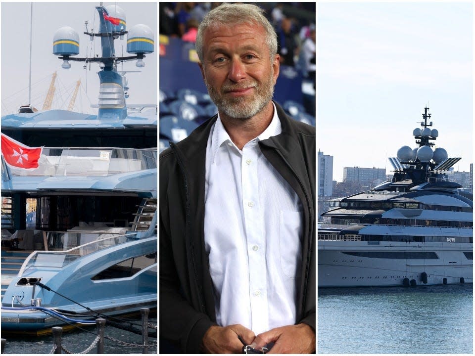 Superyachts seized on the left and right of the picture and Roman Abramovich stands in the middle.