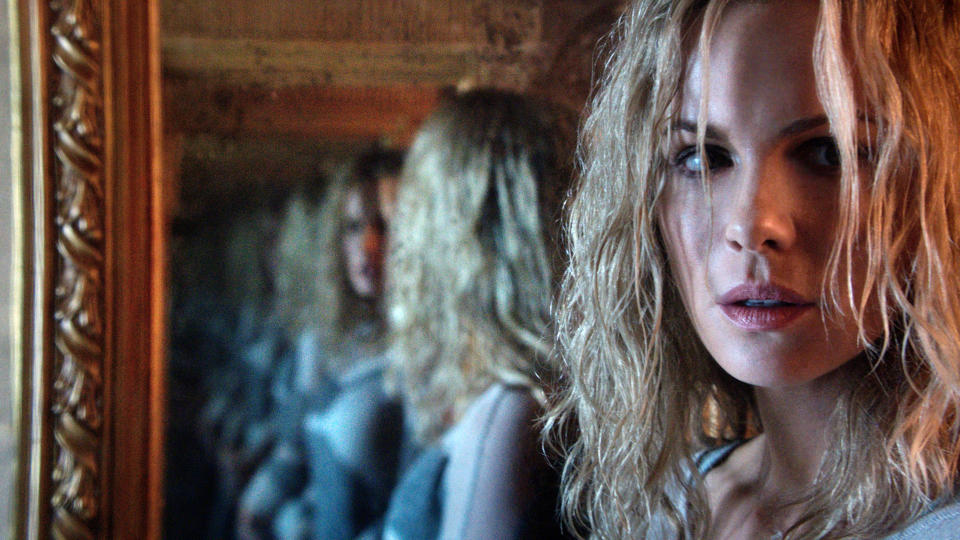 Kate Beckinsale shares a look of concern reflected in a nightmarish mirror in "The Disappointments Room"