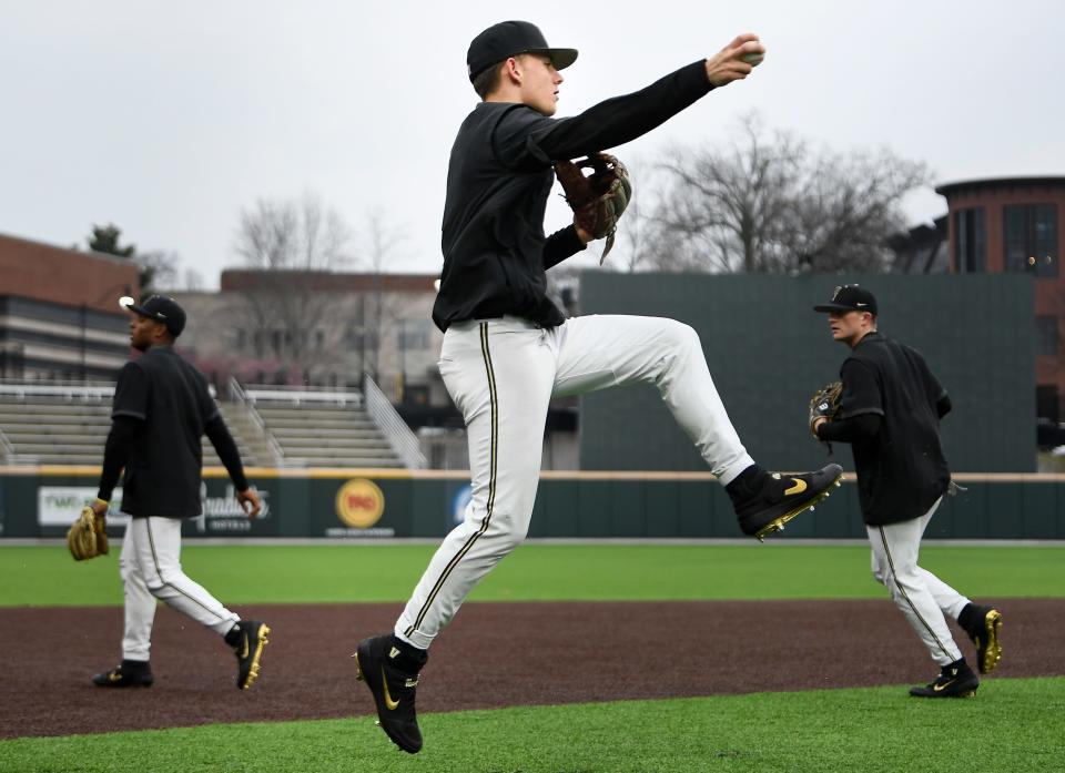 Vanderbilt infielder Carter Young runs through defensive drills during practice at Hawkins Field Tuesday, Feb. 11, 2020 in Nashville, Tenn.