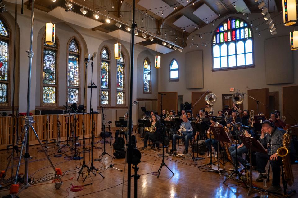The orchestra takes a break from working on the theme song and musical track for EA Sports' "College Football 25" in Studio A at Ocean Way Nashville in Nashville, Tenn., Saturday, March 16, 2024.