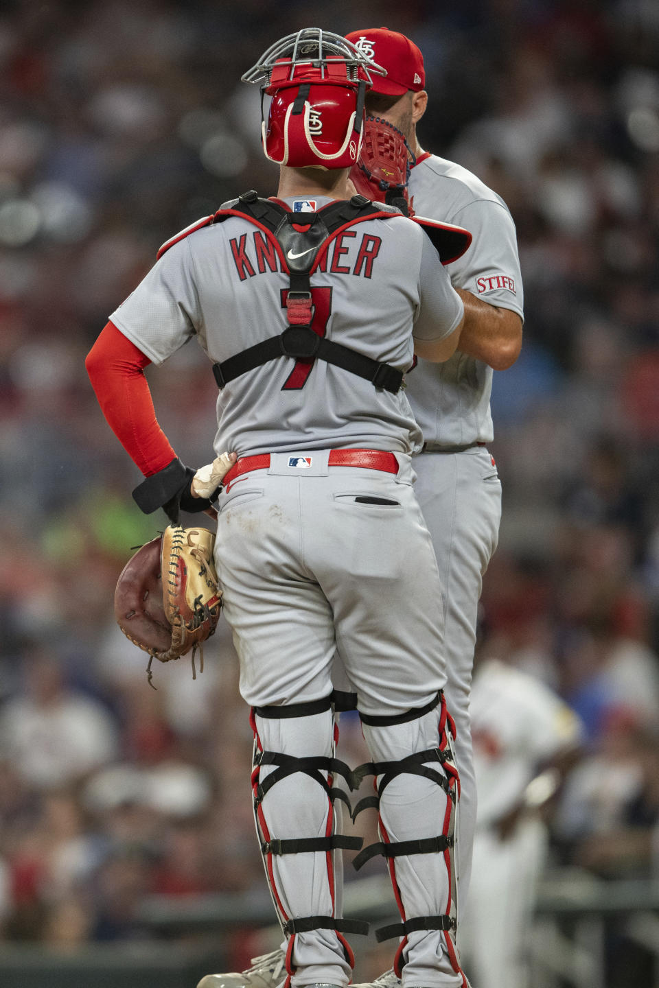 St. Louis Cardinals catcher Andrew Knizner speaks to starting pitcher Adam Wainwright during the third inning of the team's baseball game against the Atlanta Braves, Thursday, Sept. 7, 2023, in Atlanta. (AP Photo/Hakim Wright Sr.)