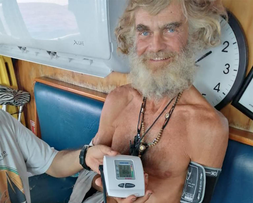 In this July 12, 2023 photo provided by Grupomar/Atun Tuny, Australian Tim Shaddock has is blood pressure taken after being rescued by a Mexican tuna boat in international waters, after being adrift with his dog for three months. Haddock and his dog Bella were aboard his incapacitated catamaran Aloha Toa some 1,200 miles from land when they were rescued. (Grupomar/Atun Tuny via AP)