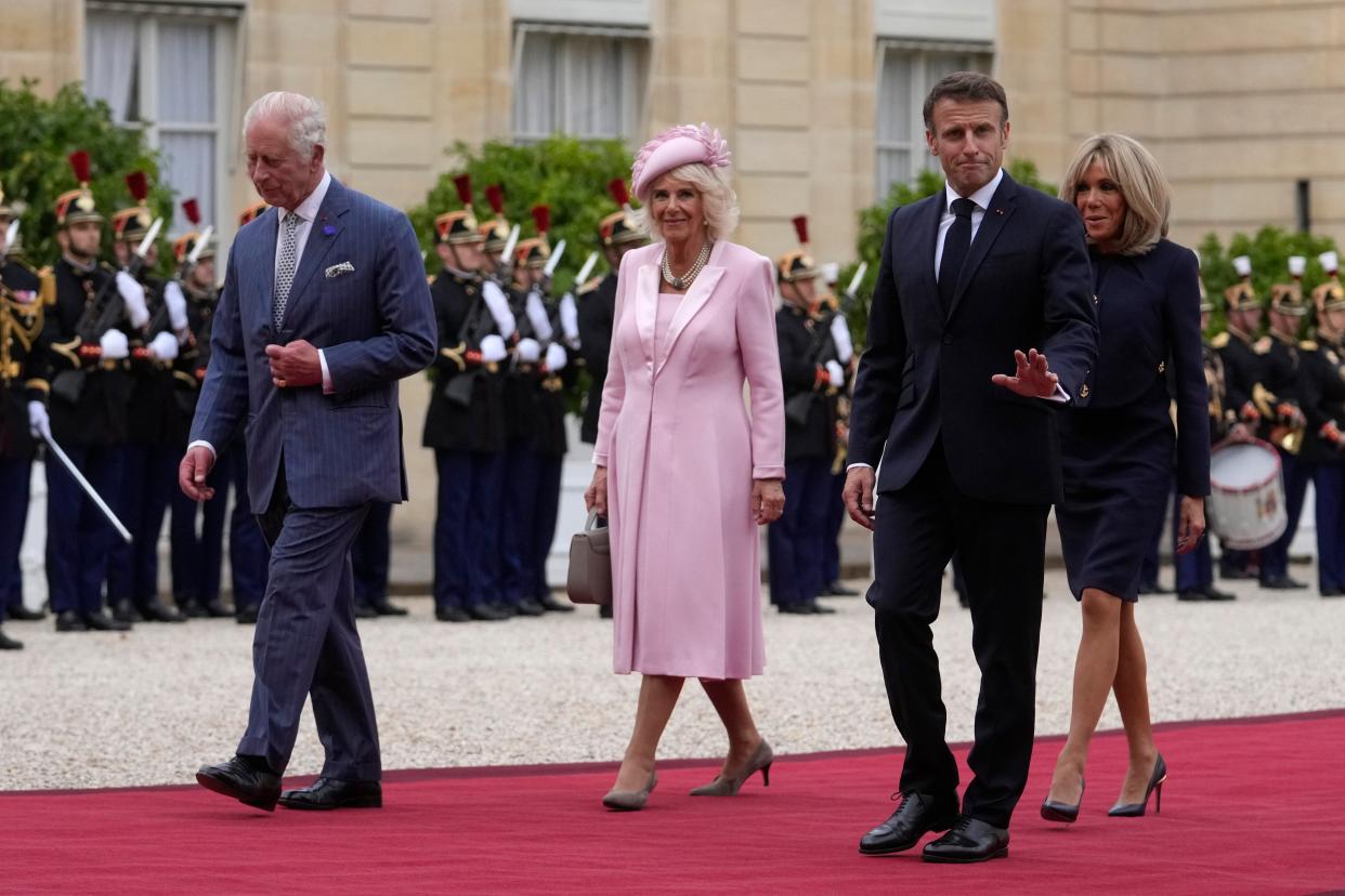 The quartet arrive at the Palace of Versailles where they will have a black-tie dinner (AP)