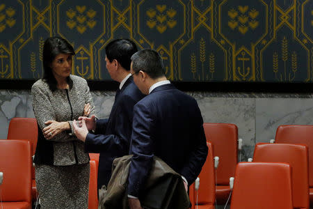 United States ambassador to the United Nations (UN) Nikki Haley speaks with Chinese Deputy UN Ambassador Wu Haitao after a meeting of the UN Security Council to discuss a North Korean missile launch at UN headquarters in New York, U.S., November 29, 2017. REUTERS/Lucas Jackson