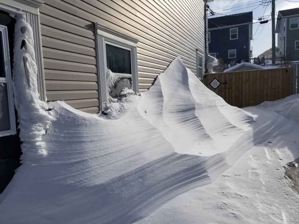 Snow covers the wall of a house in Paradise, Newfoundland, Canada January 18, 2020, in this image obtained from social media. Kim Porter/via REUTERS