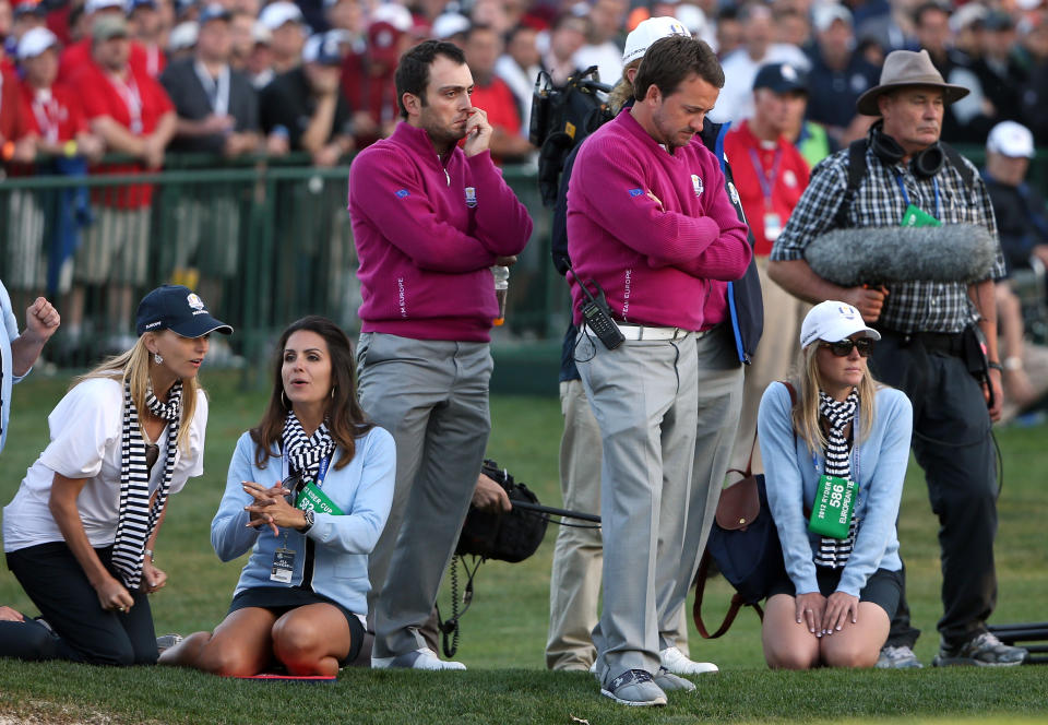 Francesco Molinari, Graeme McDowell and the European wives watches the play during day two of the Afternoon Four-Ball Matches for The 39th Ryder Cup at Medinah Country Club on September 29, 2012 in Medinah, Illinois. (Photo by Ross Kinnaird/Getty Images)