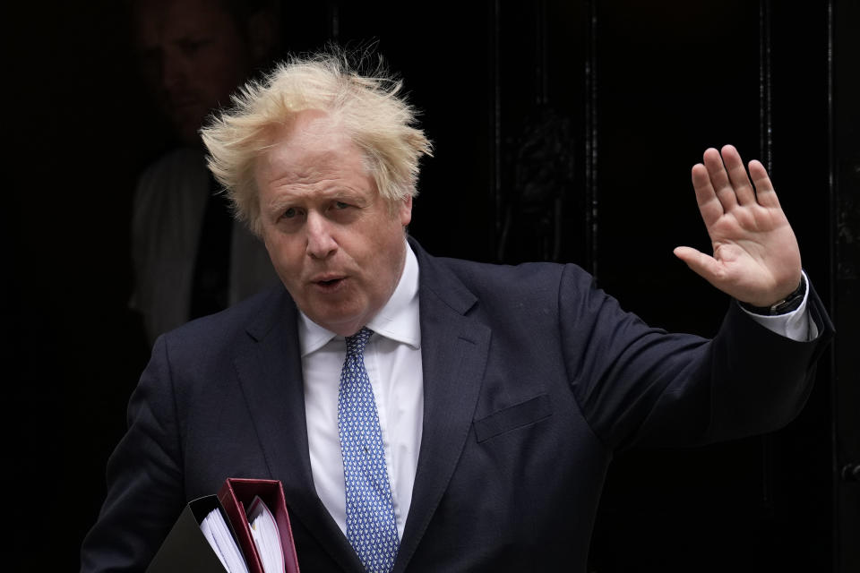 FILE - British Prime Minister Boris Johnson leaves 10 Downing Street to attend the weekly Prime Minister's Questions at the Houses of Parliament, in London, on May 25, 2022. Lawmakers are expected to release a long-awaited report Thursday, June 15, 2023 on whether former British Prime Minister Boris Johnson misled Parliament over COVID lockdown-flouting parties at his Downing Street office. (AP Photo/Matt Dunham, File)