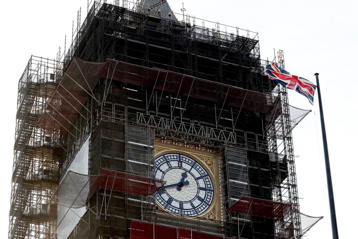 The Union flag flutters near the clockface of Big Ben during ongoing renovations to the Tower and the Houses of Parliament, in central London on January 7, 2020. (Photo by Adrian DENNIS / AFP) (Photo by ADRIAN DENNIS/AFP via Getty Images)