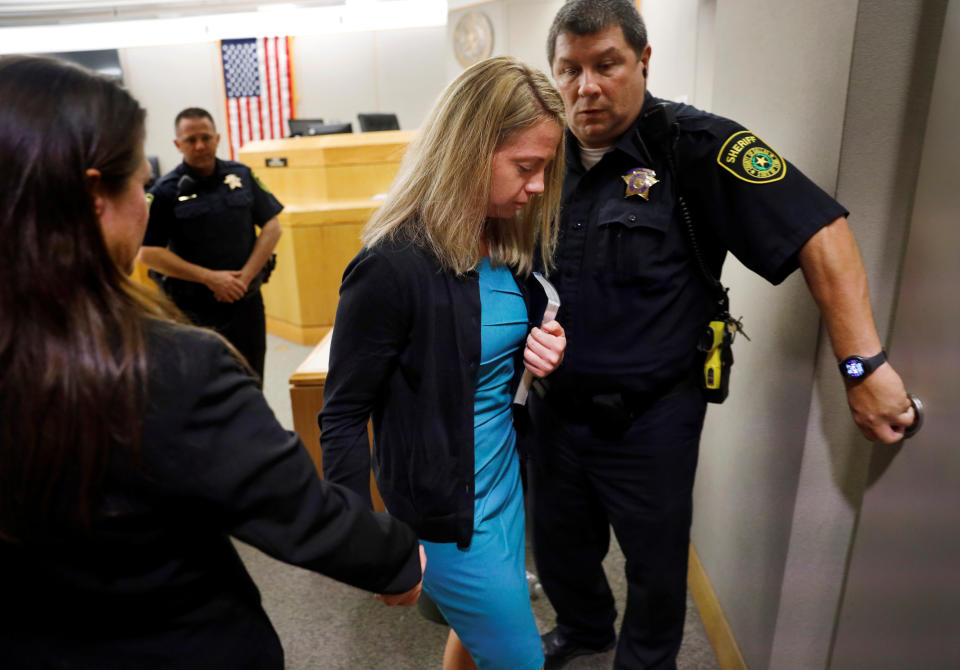 With her new Bible in hand, former Dallas police officer Amber Guyger leaves the 204th District Court for jail after receiving a hug from Botham Jean's brother Brandt Jean in Dallas on Oct. 2. (Photo: POOL New / Reuters)